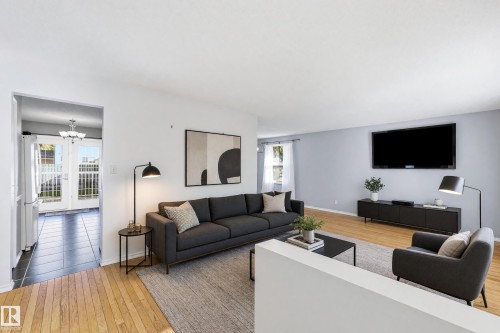 Hardwood flooring, light-toned wall finishes, recessed lighting, and white trim - 74 Aspen Crescent, St. Albert, AB 
