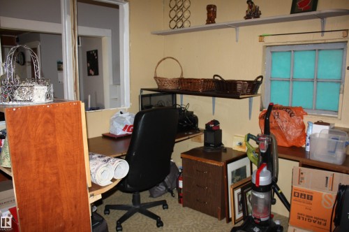 Built-in wall shelving, integrated desk surface, and multi-pane window - 5012 49 Ave, Radway, AB 