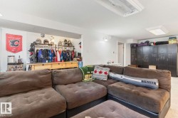 Built-in cabinetry, recessed lighting, and wall sconce - 