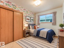 Recessed ceiling light, wood-finish sliding closet doors, built-in window, and a built-in light fixture - 
