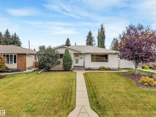 Single-story residence featuring a white siding exterior and a front-facing window - 5904 94 Avenue Nw, Edmonton, AB 