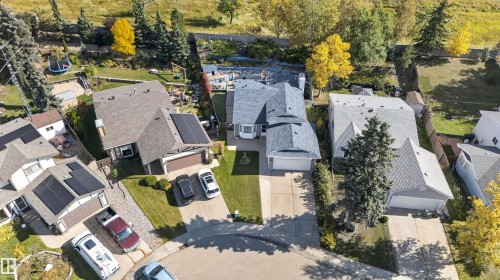 Pitched rooflines, multiple attached garages, and mature landscaping - 1519 104 Street Nw, Edmonton, AB 