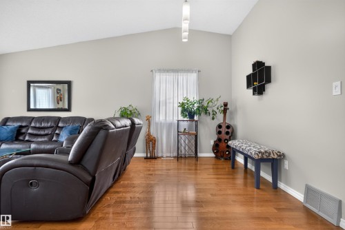 Wood-finish flooring, vaulted ceiling, and neutral wall tones - 1519 104 Street Nw, Edmonton, AB 