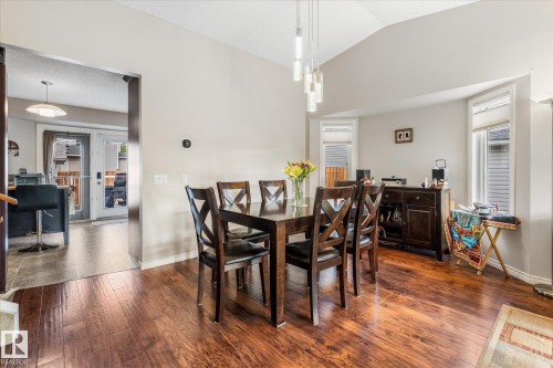 Wood-finish flooring, vaulted ceiling, and recessed lighting - 4103 44 Avenue, Stony Plain, AB 