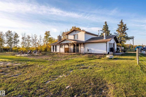 White siding exterior with a dark roof - 62202 Rr 444, Rural Bonnyville M.D., AB 