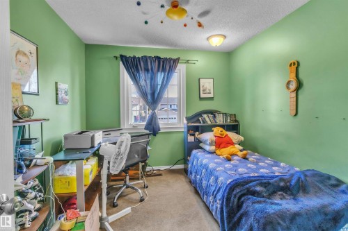 Carpeted flooring, recessed window, ceiling-mounted light fixture, and a ceiling fan - 76 Gariepy Crescent Nw, Edmonton, AB 
