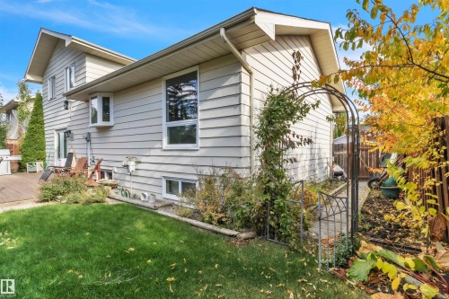 Exterior with light-colored siding, a bay window, and a wooden deck - 76 Gariepy Crescent Nw, Edmonton, AB 