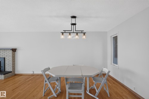 Wood-finish flooring, white painted walls, and a white window frame - 23 Clearwater, Devon, AB 