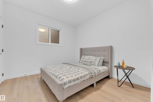 Wood-finish flooring, white walls, and a window with horizontal blinds - 2 Tenuto Link, Spruce Grove, AB 