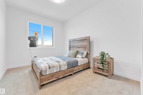 Carpeted flooring, a window with white trim, and white painted walls - 2 Tenuto Link, Spruce Grove, AB 