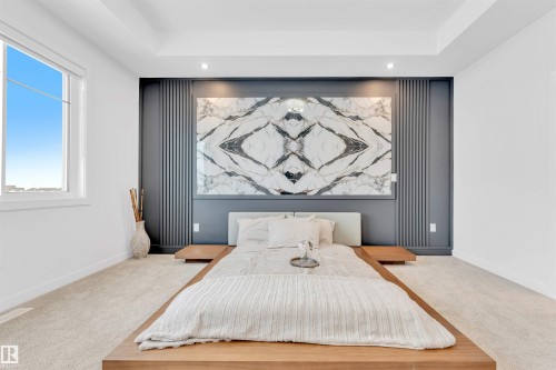 Accent wall with integrated lighting, a large window, recessed ceiling lighting, and a tray ceiling - 2 Tenuto Link, Spruce Grove, AB 