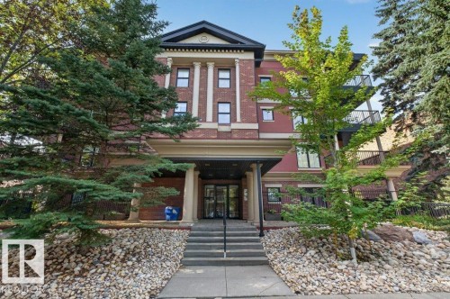 Brick facade building with architectural columns and a covered entry - #306 10232 115 St Nw, Edmonton, AB 