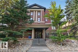 Brick facade building with architectural columns and a covered entry - 