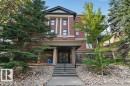 Brick facade building with architectural columns and a covered entry - #306 10232 115 St Nw, Edmonton, AB 
