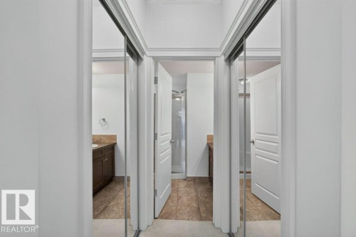 Mirrored sliding closet doors with crown molding - #306 10232 115 St Nw, Edmonton, AB 