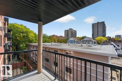Balcony featuring a black metal railing and a concrete floor - #306 10232 115 St Nw, Edmonton, AB 