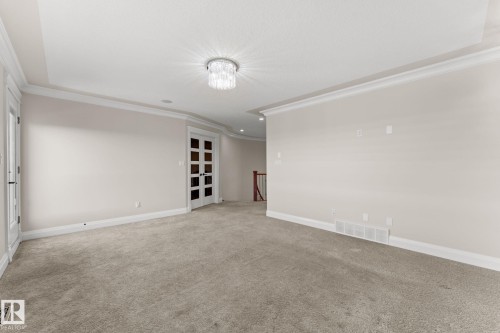 Plush carpeting, recessed lighting, and crown molding - 229 Albany Drive Nw, Edmonton, AB 