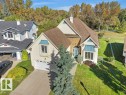 Cream stucco exterior with brick accents - 156 Phillips Row Nw, Edmonton, AB 