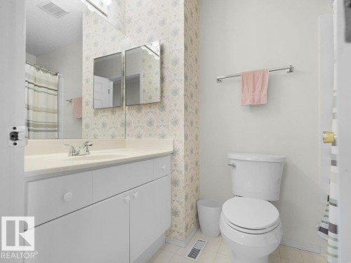 Located on the upper level. 4 pce. guest bathroom. - 156 Phillips Row Nw, Edmonton, AB 