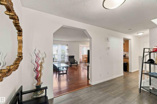 Tiled entry flooring, arched doorway, recessed lighting, and wood-finish flooring - 3524 Mclean Crescent Sw, Edmonton, AB 