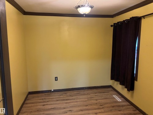 Wood-finish flooring with dark trim details - 7623 130 Avenue Nw, Edmonton, AB 