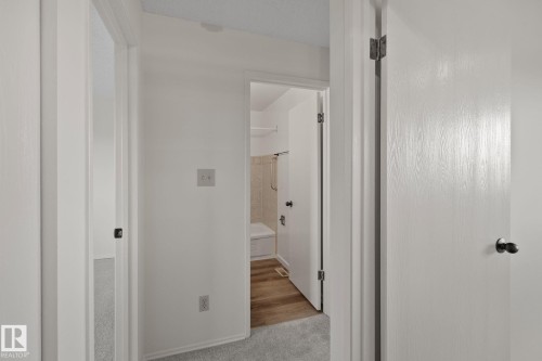 Light gray carpeting in hallway - 14411 23 Street Nw, Edmonton, AB 