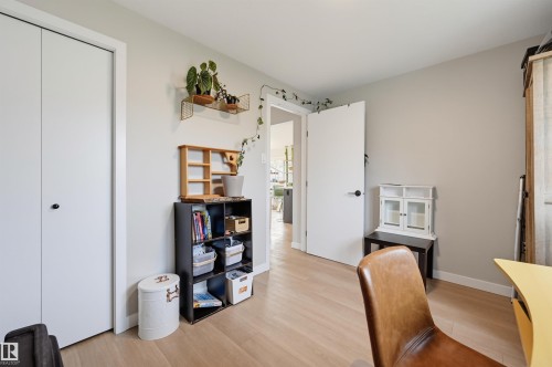 Light wood-finish flooring with a neutral wall color - 9020 152 Street Nw, Edmonton, AB 