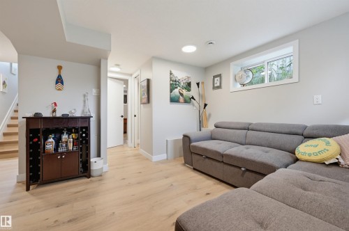 Wood-finish flooring throughout, with light gray painted walls and white trim - 9020 152 Street Nw, Edmonton, AB 
