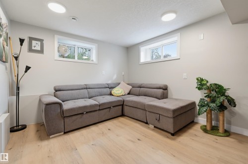 Recessed ceiling lighting, wood-finish flooring, and white trim throughout - 9020 152 Street Nw, Edmonton, AB 