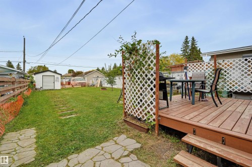 Wood-finish deck with lattice privacy screening - 9020 152 Street Nw, Edmonton, AB 