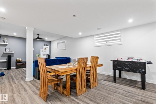 Recessed lighting, wood-finish flooring, and a column detail - 824 34 Ave Nw, Edmonton, AB 