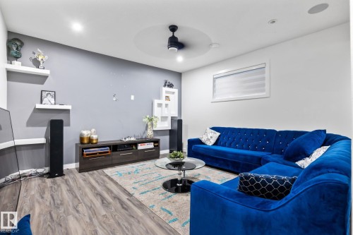Recessed lighting, wood-finish flooring, ceiling fan, and built-in shelving units - 824 34 Ave Nw, Edmonton, AB 