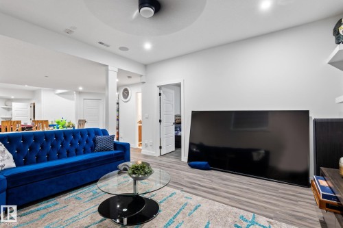 Recessed lighting, wood-finish flooring, ceiling fan, white interior doors, and built-in shelving - 824 34 Ave Nw, Edmonton, AB 