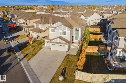 Two-story residence with attached double garage and extended concrete driveway - 824 34 Ave Nw, Edmonton, AB 