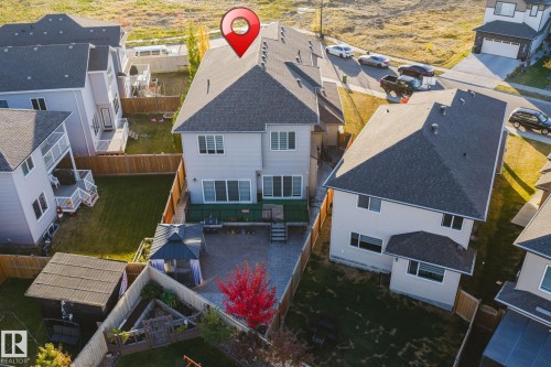 Backyard featuring a paved patio area, covered gazebo, and a detached shed - 824 34 Ave Nw, Edmonton, AB 