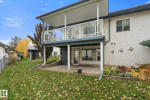 Covered upper deck with glass railings - 7 Linkside Pl, Spruce Grove, AB 