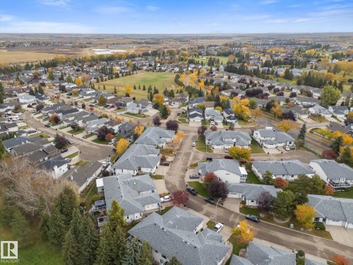 Residential neighborhood with mature trees and paved streets - 7 Linkside Pl, Spruce Grove, AB 