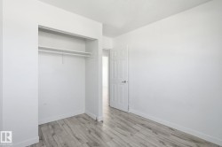 Wood-finish flooring with white walls - 