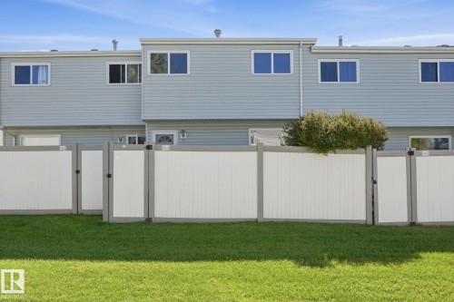 Vinyl siding exterior with multiple upper-level windows - 164 Dickinsfield Court Nw, Edmonton, AB 