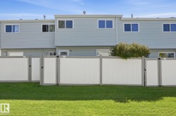Vinyl siding exterior with multiple upper-level windows - 