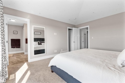 Plush carpet flooring, neutral paint palette, overhead lighting, and white trim - 3334 Parker Loop Sw, Edmonton, AB 
