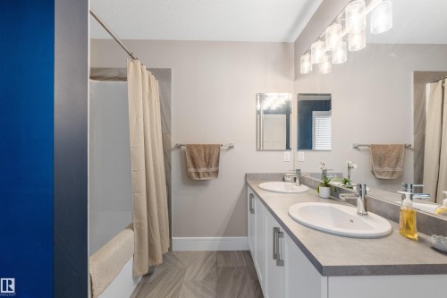 Dual vanity with undermount sinks and chrome fixtures - 3334 Parker Loop Sw, Edmonton, AB 