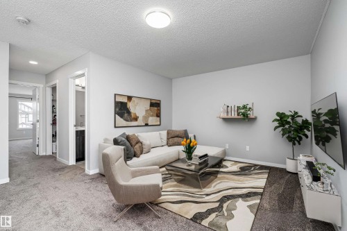 Plush carpeting throughout, bright overhead lighting, and white trim - 9227 223 Street Nw, Edmonton, AB 