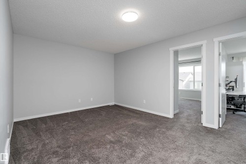 Plush carpeting, recessed lighting, and bright white trim - 9227 223 Street Nw, Edmonton, AB 