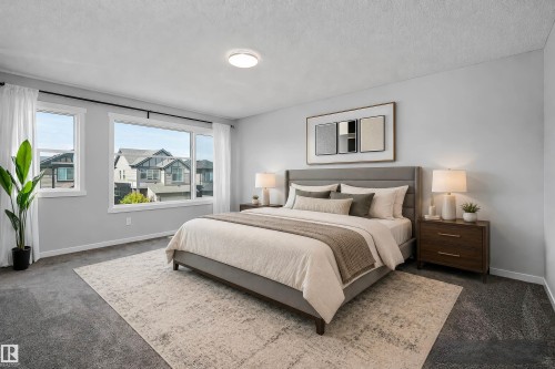 Wall-to-wall carpeting with a light neutral wall color - 9227 223 Street Nw, Edmonton, AB 