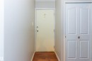 Wood-finish flooring with a light wall color - #6 3819 76 St Nw, Edmonton, AB 