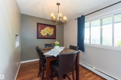 Wood-finish flooring, built-in wall niche, multiple-pane window, and a ceiling-mounted light fixture - 
