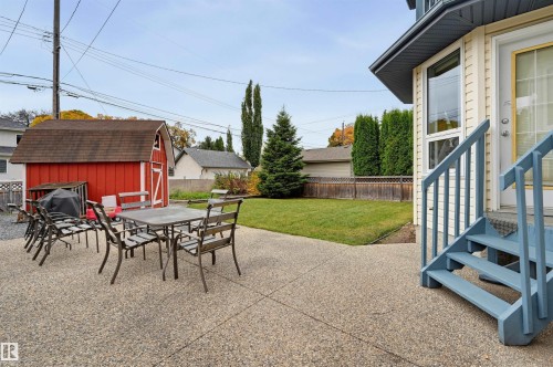 Expansive concrete patio with direct access to the interior - 7521 111 Avenue Nw, Edmonton, AB 