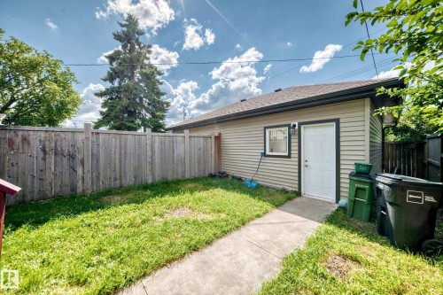 Detached structure with horizontal siding, a single window, and a white entry door - 12730 118 Street Nw, Edmonton, AB 