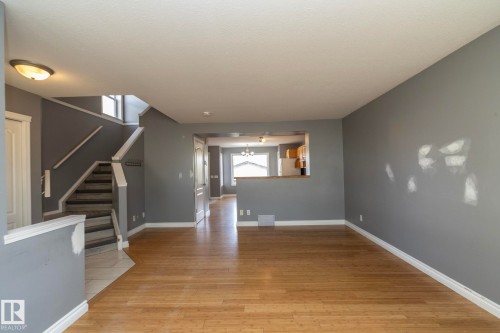 Wood-finish flooring throughout the main living space - 137 Michigan Street, Devon, AB 